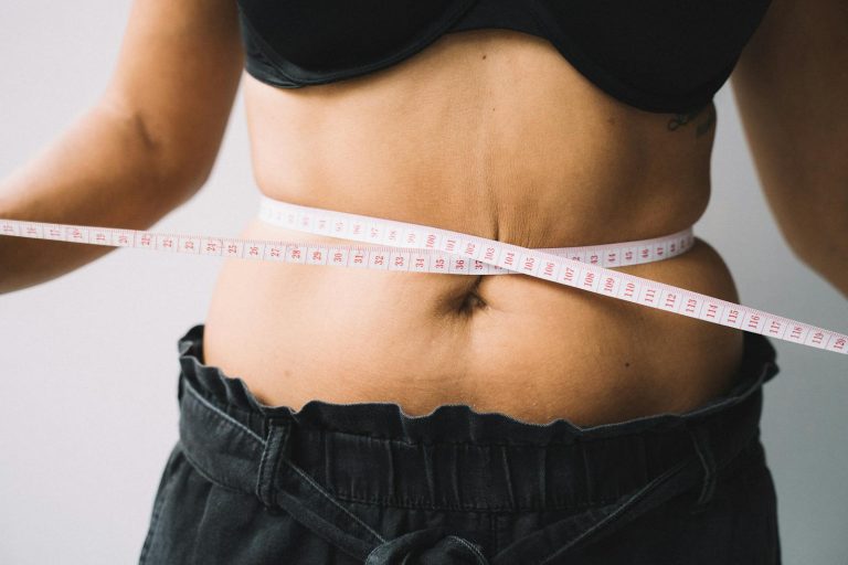 Photo of a Tape Measure on a Person's Waist